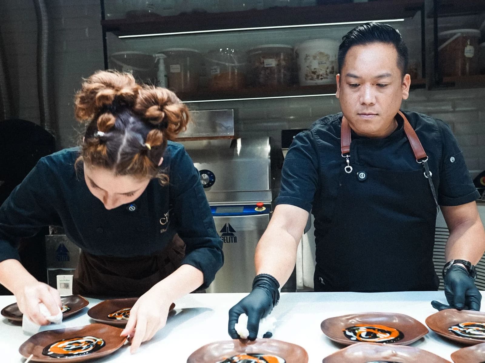 Chefs plating a chocolate course at Atelier After Dark